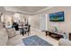 Inviting living room featuring neutral tones, comfortable seating, and a flat-screen TV at 230 E Flamingo Rd # 115, Las Vegas, NV 89169