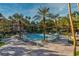Resort-style pool and lounge area surrounded by mature palm trees, perfect for relaxation at 230 E Flamingo Rd # 115, Las Vegas, NV 89169