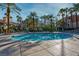 Large, sparkling pool surrounded by palm trees and lounge chairs, perfect for relaxation at 230 E Flamingo Rd # 115, Las Vegas, NV 89169