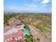 Expansive aerial view featuring a gorgeous home with a pool and spa, with mountain and golf course views at 2660 Mirabella St, Henderson, NV 89052