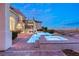 Luxury home features a stunning backyard pool, spa, and outdoor staircase with desert views at 2660 Mirabella St, Henderson, NV 89052