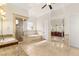 Luxurious bathroom featuring a walk-in shower, separate tub, and dual vanities, offering a spa-like experience at 2660 Mirabella St, Henderson, NV 89052