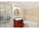 A bathroom featuring a tub/shower combo, marble countertop and tile, and natural light at 2660 Mirabella St, Henderson, NV 89052
