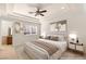 Bedroom featuring a well-made bed, bedside tables and artwork at 2660 Mirabella St, Henderson, NV 89052