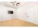 A bright bedroom with wood floor and a wall-mounted TV at 2660 Mirabella St, Henderson, NV 89052