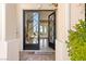 Grand entrance showcasing elegant double doors that lead to the light-filled living space at 2660 Mirabella St, Henderson, NV 89052