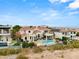 Elegant two-story house featuring a refreshing pool, desert landscaping and a beautiful red tile roof at 2660 Mirabella St, Henderson, NV 89052