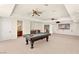 Spacious game room with a pool table, wet bar and large projector screen for entertaining at 2660 Mirabella St, Henderson, NV 89052