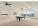 Bright game room featuring a pool table and sliding glass doors leading to outdoor area at 2660 Mirabella St, Henderson, NV 89052