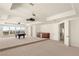 Large game room featuring a pool table, wet bar, and access to the outdoor patio at 2660 Mirabella St, Henderson, NV 89052