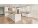 Bright kitchen features a large island, custom cabinets, granite countertops, and stainless appliances at 2660 Mirabella St, Henderson, NV 89052