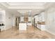 Open kitchen with large center island, stainless steel appliances, and custom cabinetry at 2660 Mirabella St, Henderson, NV 89052