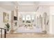 Bright, open living room featuring high ceilings, fireplace, and tall windows with neighborhood views at 2660 Mirabella St, Henderson, NV 89052