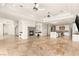 Open living room featuring high ceilings, a stone fireplace and kitchen view at 2660 Mirabella St, Henderson, NV 89052