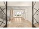Spacious living area featuring high ceilings, a fireplace, columns, and large windows for natural light at 2660 Mirabella St, Henderson, NV 89052