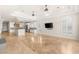 Open living room featuring high ceilings, ceiling fans, and kitchen view at 2660 Mirabella St, Henderson, NV 89052