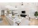 Open living room featuring high ceilings, ceiling fans and kitchen view at 2660 Mirabella St, Henderson, NV 89052
