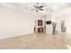 Spacious open living area with high ceilings, a wet bar, and a fireplace, perfect for entertaining at 2660 Mirabella St, Henderson, NV 89052
