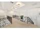 A second story hallway/loft with high ceilings and decorative wrought iron railing at 2660 Mirabella St, Henderson, NV 89052