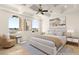 Serene primary bedroom featuring neutral tones, arched windows, and plush furnishings for a relaxing retreat at 2660 Mirabella St, Henderson, NV 89052