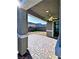 Covered back patio with ceiling fan, paver flooring and views of the backyard at 290 Mount Williamson St, Henderson, NV 89015