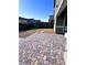 The backyard features a paver patio, gravel beds, and a stepping stone path leading to a patch of artificial turf at 290 Mount Williamson St, Henderson, NV 89015