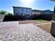 A beautifully landscaped backyard featuring a paver patio, gravel beds and a touch of green space at 290 Mount Williamson St, Henderson, NV 89015