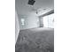 Spacious carpeted bedroom with a ceiling fan and a sliding glass door at 290 Mount Williamson St, Henderson, NV 89015
