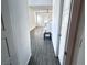 View into the living room with wood flooring and a modern ceiling fan at 290 Mount Williamson St, Henderson, NV 89015