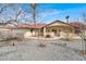 Attractive one-story home boasts a low-maintenance landscape with desert foliage and a front-facing two-car garage at 2961 Ponderosa Ave, Pahrump, NV 89048