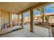 Covered back patio with tiled flooring offering an outdoor lounge space with a clear view of the yard at 317 Shimmering Moon St, Henderson, NV 89015