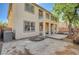 A home's backyard featuring a concrete patio, partial fence, and second-story balcony at 317 Shimmering Moon St, Henderson, NV 89015