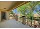 This covered balcony features dark iron railings with a stucco facade and offers views of the mountains at 317 Shimmering Moon St, Henderson, NV 89015