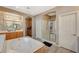 Bright bathroom with oversized tub, and vanity and sinks, and large walk in shower at 317 Shimmering Moon St, Henderson, NV 89015