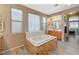 Bright bathroom with oversized tub, and vanity and sinks, wood-look floors and neutral paint at 317 Shimmering Moon St, Henderson, NV 89015