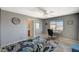 Bright bedroom featuring a large window, neutral walls, carpet, and adjacent bathroom at 317 Shimmering Moon St, Henderson, NV 89015