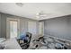 This bedroom has grey walls, white ceilings, and a white ceiling fan with a light at 317 Shimmering Moon St, Henderson, NV 89015