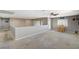 Spacious upstairs bonus room with neutral carpet, access to the outside, and a small dining area at 317 Shimmering Moon St, Henderson, NV 89015