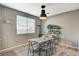 Bright dining area featuring modern lighting, a gray wood table with seating for four and decorative wall art at 317 Shimmering Moon St, Henderson, NV 89015