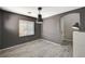 Spacious room with wood-look tile, neutral walls, and a decorative wall cutout at 317 Shimmering Moon St, Henderson, NV 89015