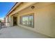 This exterior view shows a door leading to a balcony, featuring a stucco facade and outdoor lighting at 317 Shimmering Moon St, Henderson, NV 89015