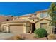 Charming two-story home featuring a three-car garage and xeriscaping at 317 Shimmering Moon St, Henderson, NV 89015