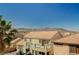 This is an exterior shot that shows the layout of the backyard and the surrounding mountains at 317 Shimmering Moon St, Henderson, NV 89015