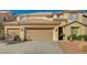 Charming two-story home featuring a three-car garage and well-maintained landscaping at 317 Shimmering Moon St, Henderson, NV 89015