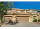 Charming two-story home featuring a three-car garage and well-maintained landscaping at 317 Shimmering Moon St, Henderson, NV 89015