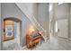 Inviting foyer featuring tile floors, staircase, and a view into the kitchen at 317 Shimmering Moon St, Henderson, NV 89015
