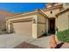 Close-up of the home's three-car garage, showcasing its functionality and access at 317 Shimmering Moon St, Henderson, NV 89015