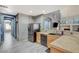 Well-equipped kitchen features wood cabinets, granite countertops, and a seamless transition to the living spaces at 317 Shimmering Moon St, Henderson, NV 89015