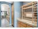 Kitchen pantry space with shelving units, gray countertop, and plenty of storage space at 317 Shimmering Moon St, Henderson, NV 89015