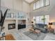 Open living room with fireplace and large windows, creating a bright and welcoming space at 317 Shimmering Moon St, Henderson, NV 89015